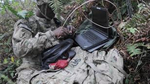 A soldier sets up voice intercept equipment during a cyber integration exercise on Joint Base Lewis-McChord, Washington, October 21, 2015