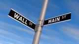 Street sign with Wall St. and Main St. signs, photo by BobHemphill/Getty Images