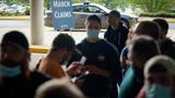 People line up outside a career center, hoping to find assistance with their unemployment claims, Frankfort, Kentucky, June 18, 2020, photo by Bryan Woolston/Reuters