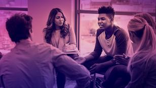 In therapy, man shares life experiences with group. 