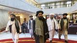 Mullah Abdul Ghani Baradar and other Taliban delegation members attend the Afghan peace conference in Moscow, Russia, March 18, 2021, photo by Alexander Zemlianichenko/Pool via Reuters