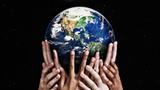 Hands holding up a globe, photo by RapidEye/Getty Images