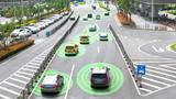 Autonomous vehicles driving on a city road with a graphic circle representing sensors. Photo by JIRAROJ PRADITCHAROENKUL / Getty Images