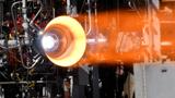 NASA successfully hot-fire tested a 3-D printed copper combustion tank liner. NASA successfully hot-fire tested a 3-D printed copper combustion chamber liner with an E-Beam Free Form Fabrication manufactured nickel-alloy jacket, photo by NASA/MSFC/David Olive