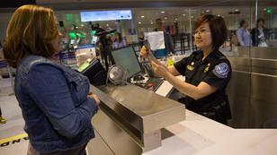 Officers with the U.S. Customs and Border Protection, Office of Field Operations, process international arrivals of passenger flights at Boston.
