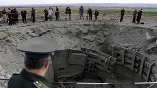 A Ukrainian army officer looks at a destroyed SS-24 missile silo near the town of Pervomaisk, Ukraine, October 30, 2001, photo by Gleb Garanich CVI/CLH//Reuters