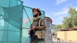 A Taliban fighter stands guard near the site where Al Qaeda leader Ayman al-Zawahiri was killed in a U.S. strike over the weekend, in Kabul, Afghanistan, August 2, 2022, photo by Stringer/Reuters