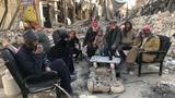 Residents of Raqqa gather in the morning to drink tea after they had been allowed back to inspect their homes, photo by Aboud Hamam