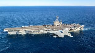 An F/A-18E Super Hornet flies near the aircraft carrier USS Harry S. Truman in the Mediterranean Sea, January 22, 2022, photo by U.S. Navy