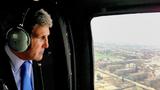 U.S. Secretary of State John Kerry views Kabul from the window of a Black Hawk military helicopter in Kabul, Afghanistan, March 26, 2013, photo by U.S. State Department/Alamy