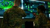  Marines with Marine Corps Forces Cyberspace Command observe computer screens in the cyber operations center at Fort Meade, Md., Feb. 5, 2020, photo by Marine Corps Staff Sgt. Jacob Osborne/U.S. Department of Defense