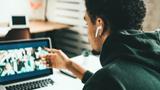 Young black man has video conference call, photo by alexey chigretskiy/Adobe Stock