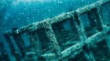Numerous square concrete blocks are stacked on top of each other underwater to create an artificial reef, photo by Placebo365/Getty Images