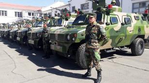 Bolivian soldiers stand next to military vehicles received by Bolivian Armed Forces from the Chinese government in La Paz, Bolivia, July 29, 2016, photo by Bolivian Information Agency/Handout via Reuters