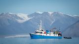 A fishing boat off the coast of Pond Inlet, in the Canadian Arctic, August 15, 2019, photo by Kay Nietfeld/Reuters