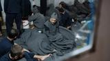 Prisoners suspected of being part of the Islamic State, lie inside a prison cell in Hasaka, Syria, January 7, 2020, photo by Goran Tomasevic/Reuters