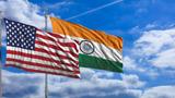  India and America waving flags on blue sky. 3d illustration, photo by Rawf8 / Adobe Stock