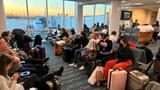 Stranded passengers wait at Orlando International Airport as flights were grounded after the FAA system outage, in Orlando, Florida, January 11, 2023, photo by Lou Mongello via Reuters