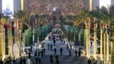 Participants walk near the conference center on the final evening of the U.N. Climate Change Conference (COP28) in Dubai, United Arab Emirates, December 12, 2023, photo by Dominika Zarzycka/Reuters