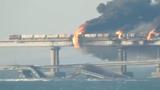 The Kerch bridge on fire after an explosion on the rail section of the bridge, between Crimea and mainland Russia, October 8, 2022, photo by EyePress News/Reuters