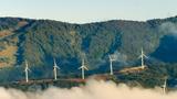 Wind turbines surrounded by fog in Costa Rica, photo by OGphoto/Getty Images