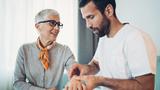 Naturopathic doctor talking with an elderly patient, photo by pixelfit/Getty Images
