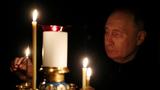 Russian President Vladimir Putin lights a candle in memory of the victims of the Crocus City Hall attack at the Novo-Ogaryovo state residence outside Moscow, Russia, March 24, 2024, photo by Mikhail Metzel/Sputnik via Reuters