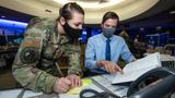 U.S. Space Force members working together at desk
