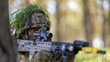 Soldier in woodland during Exercise Aurora 23, photo by Petty Officer Joel Rouse/UK MOD © Crown 2022
