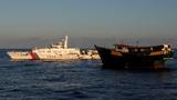  A Chinese Coast Guard vessel blocks a Philippine resupply vessel on its way to a resupply mission at Second Thomas Shoal in the South China Sea, March 5, 2024, photo by Adrian Portugal/Reuters