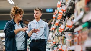 Supermarket manager giving training to a trainee, photo by Jacob Lund/Adobe Stock