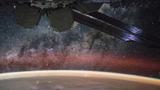 An image taken from the International Space Station shows orange swaths of airglow hovering in Earth’s atmosphere, photo by NASA