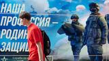A man walks past a contract army service mobile recruitment point (The banner reads, "Our profession is to defend the Motherland.") in Moscow, July 7, 2023, photo by Nikolay Vinokurov/Alamy Stock
