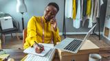 Young Black entrepreneur working in her office, photo by ljubaphoto/Getty Images