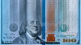 Binary code obscuring the appearance of a one-hundred-dollar bill, image by imagedepotpro/Getty Images