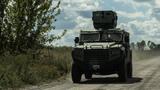 Ukrainian servicemen ride a military vehicle near the Russian border in Sumy region, Ukraine, August 12, 2024, photo by Viacheslav Ratynskyi/Reuters
