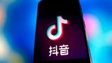 The TikTok logo on a phone, illustration by CFOTO/Sipa USA via Reuters 
