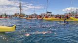 A paddle-out ceremony is held with surfers and boats to commemorate the first anniversary of the Lahaina wildfire, on Maui, Hawaii, August 8, 2024, photo by Kyodo via Reuters