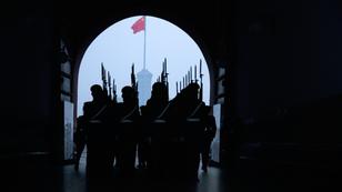 Soldiers prepare to change the flags at Tiananmen Square in Beijing, China, November 20, 2006, photo by Petra Wallner/imageBROKER.com GmbH & Co. KG/Alamy Stock Photo