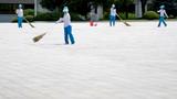 Women clean bricks outside the Kumsusan Palace of the Sun in Pyongyang, North Korea, July 7, 2018, photo by Andrew Harnik/Pool via Reuters