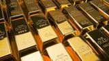 Rows of gold bars, stamped with the words, "FINE GOLD 999.9 Net wt 1000 g", photo by misunseo/Adobe Stock