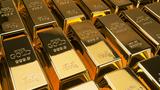 Rows of gold bars, stamped with the words, "FINE GOLD 999.9 Net wt 1000 g", photo by misunseo/Adobe Stock