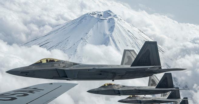 U.S. Air Force Raptors fly alongside a USAF Stratotanker during fighter training near Mt. Fuji, Japan, April 1, 2021, photo by SrA Rebeckah Medeiros/U.S. Air Force