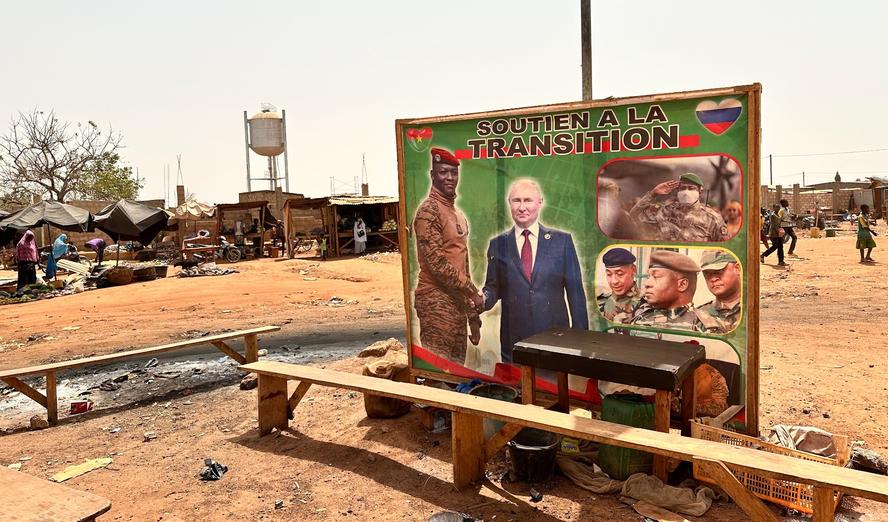 Russian President Vladimir Putin and Burkina Faso's interim military president Ibrahim Traor&eacute; are pictured on a poster with the slogan &ldquo;Support for the transition&rdquo; in Ouagadougou, Burkina Faso, March 5, 2024, photo by Christina Peters/Reuters