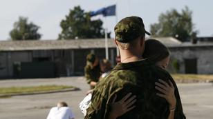 Woman hugging soldier