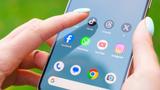 Closeup of a person's hands holding an Android phone about to open TikTok, photo by georgeclerk/Getty Images