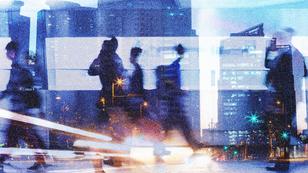 People walking in a city, surrounded by lights and a blur of motion, image by kieferpix/Adobe Stock