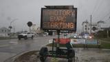 A mandatory evacuation sign at Fort Myers Beach as Hurricane Milton approaches on October 7, 2024, photo by Andrew West/USA Today via Reuters