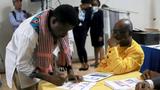 A delegate votes during an election to choose the Montana Accord's new transitional president at the Kinam hotel in Port-au-Prince, Haiti, January 30, 2022, photo by Ralph Tedy Erol/Reuters