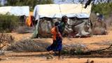 After fleeing drought in Somalia, a Somali girl carries her sibling in the Hagadera refugee camp in Dadaab, Kenya, January 17, 2023, photo by Thomas Mukoya/Reuters